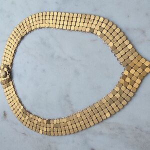gold-tone mesh choker necklace, also known as a panther link or Cleopatra style